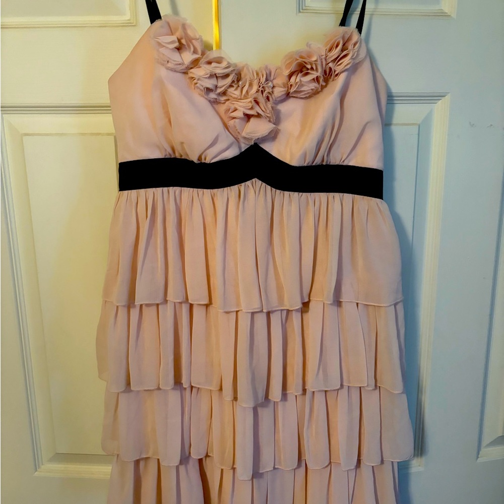 Pink 4 tiered spaghetti strap dress with rosettes and pearl embellishments!